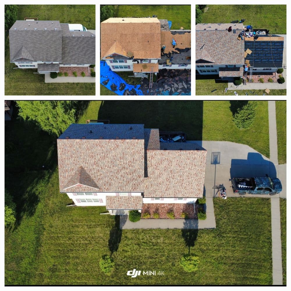 Aerial view of a house undergoing roof replacement with workers and materials visible.