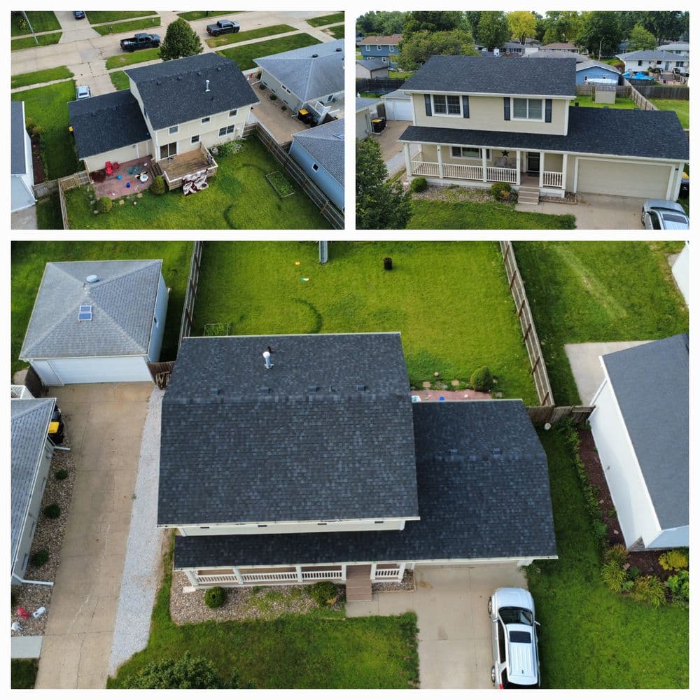Aerial view of homes with new roofs, showcasing three distinct properties and landscaping.